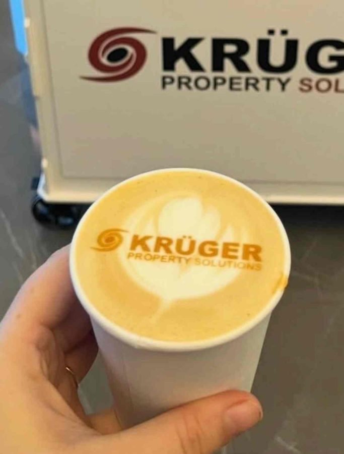 Kruger Property Solutions logo printed on a latte foam at a corporate event