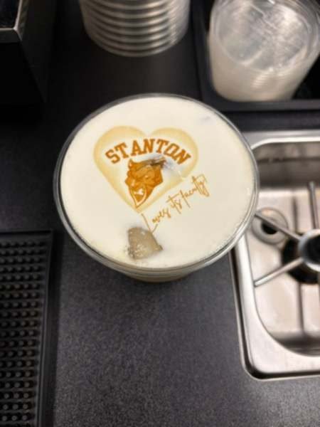 Stanton College Preparatory logo printed on an iced latte